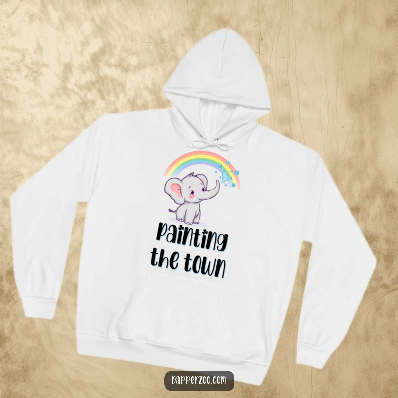 Funny tiny elephant character sprays water from its trunk to create a rainbow, featured on this cozy hoodie.