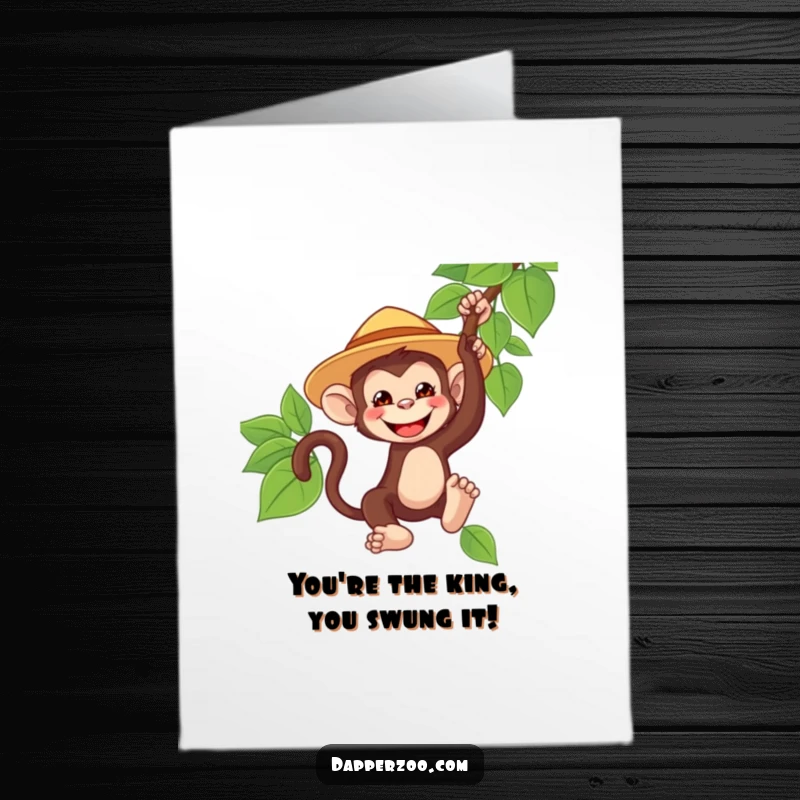 Funny Free Printable Congratulations Card: A grinning monkey wearing an oversized safari hat swings from a vine, celebrating a victory.