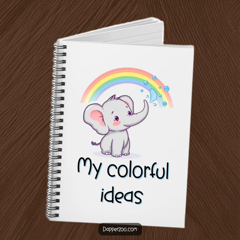 Funny tiny elephant character spraying water from its trunk to create a rainbow on a notebook, for colorful ideas.