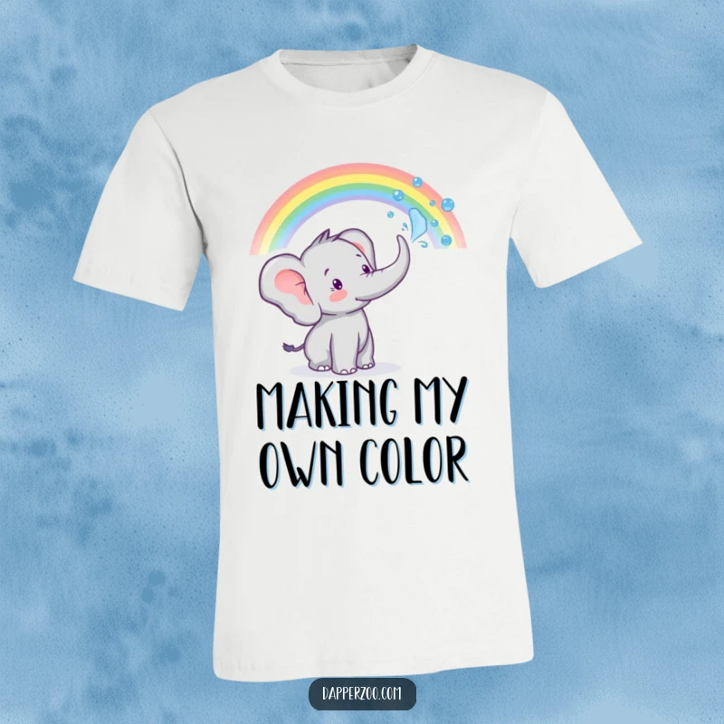 A tiny elephant sprays water from its trunk to make a rainbow, depicted on this funny t-shirt.