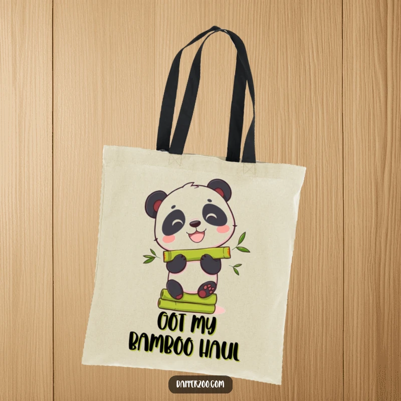 Funny panda tote bag showing a curious bear with a wide grin trying to balance bamboo.