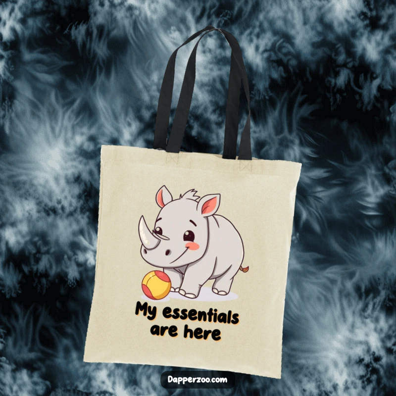 Funny rhinoceros calf tote bag featuring a happy calf playfully nudging a small, colorful ball.